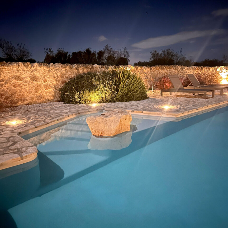 The pool after sunset covered in soft illumination.