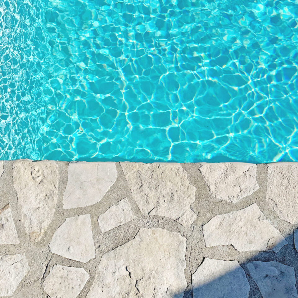 Blue pool and white stones